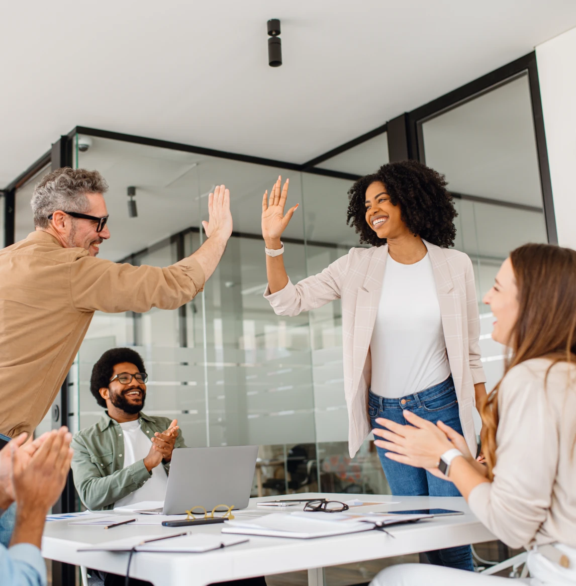 Business team celebrating with high five